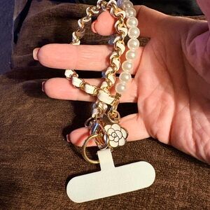 Elegant Gold and Pearl Women's Bracelet for cellphones.